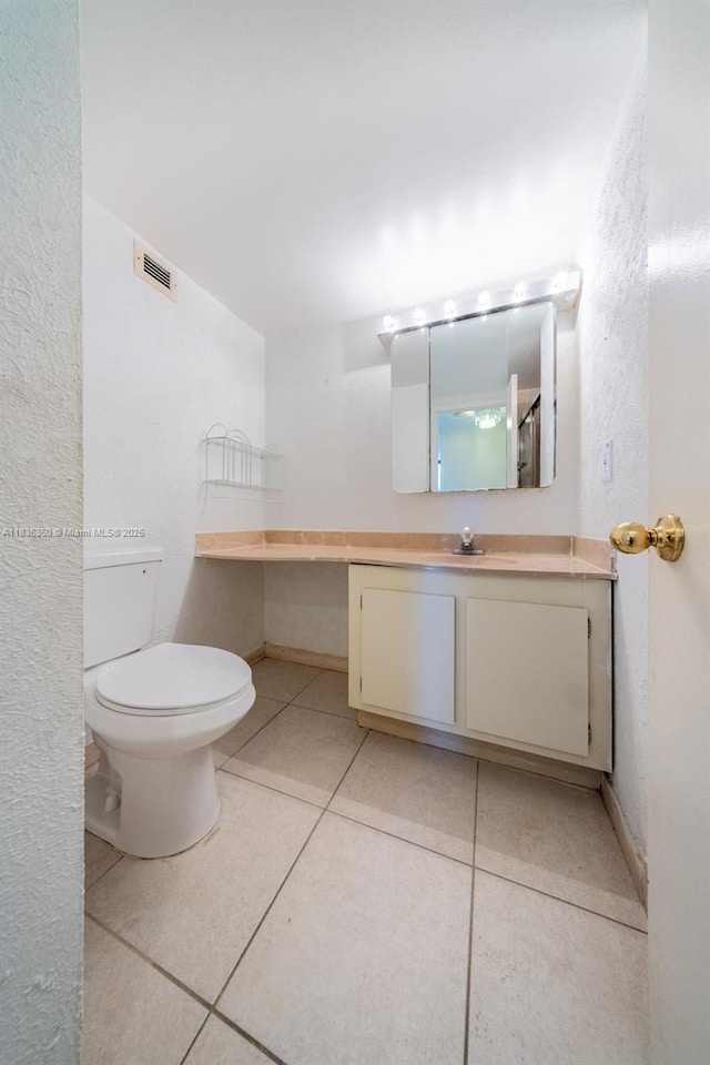 2500 Parkview Dr Unit 1502, Hallandale Beach, FL 33009 - bathroom featuring vanity, tile patterned floors, and a textured wall