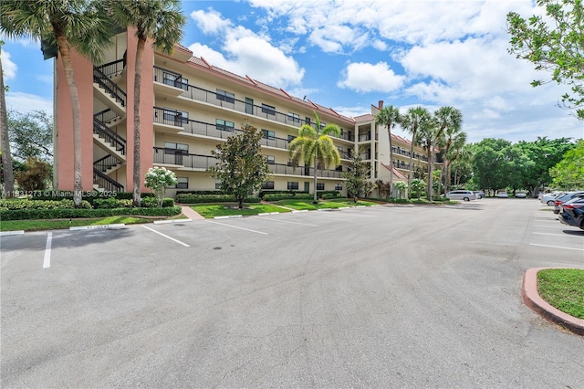 1706 Hammock Blvd Unit 110, Coconut Creek, FL 33063 - view of apartment building / complex with uncovered parking