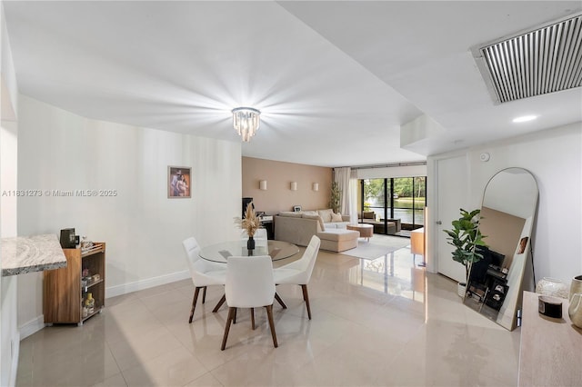 1706 Hammock Blvd Unit 110, Coconut Creek, FL 33063 - dining area with light tile patterned flooring and baseboards