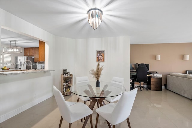 1706 Hammock Blvd Unit 110, Coconut Creek, FL 33063 - dining area with light tile patterned flooring, a chandelier, and a desk
