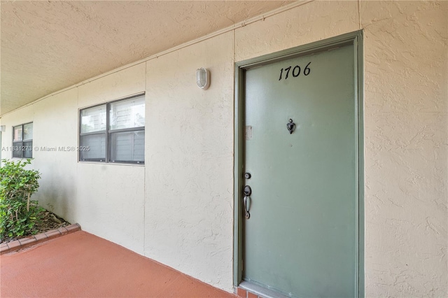 1706 Hammock Blvd Unit 110, Coconut Creek, FL 33063 - property entrance with stucco siding