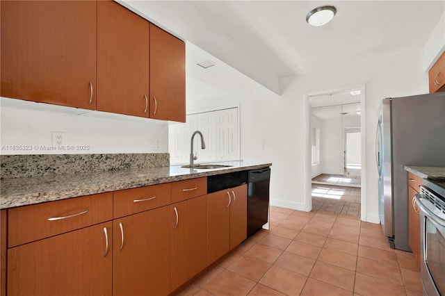 15831 Palmetto Club Dr, Miami, FL 33157 - kitchen with dishwasher, light tile patterned floors, stove, and light stone countertops