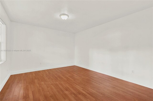 15831 Palmetto Club Dr, Miami, FL 33157 - unfurnished room with wood finished floors and baseboards