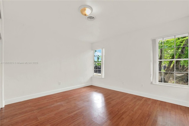 15831 Palmetto Club Dr, Miami, FL 33157 - unfurnished room with plenty of natural light and wood finished floors