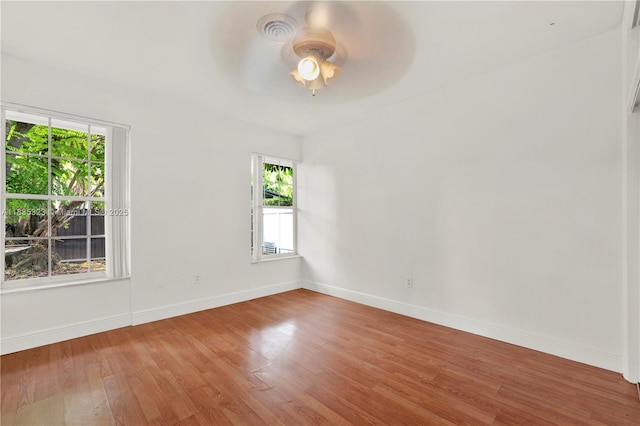 15831 Palmetto Club Dr, Miami, FL 33157 - empty room with ceiling fan, plenty of natural light, and wood finished floors