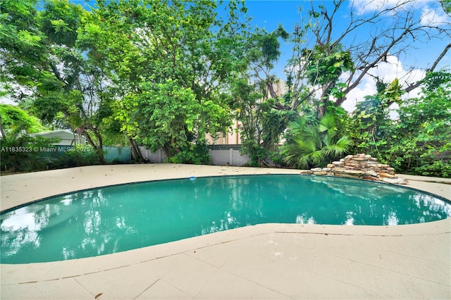 15831 Palmetto Club Dr, Miami, FL 33157 - view of swimming pool with a patio