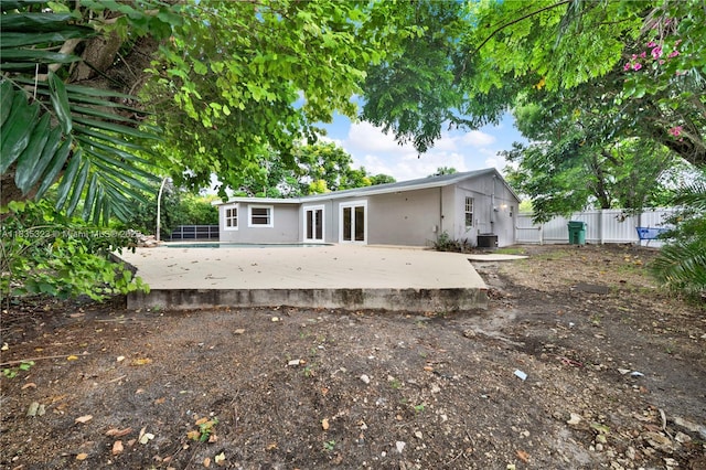15831 Palmetto Club Dr, Miami, FL 33157 - rear view of property featuring a patio, stucco siding, and a swimming pool