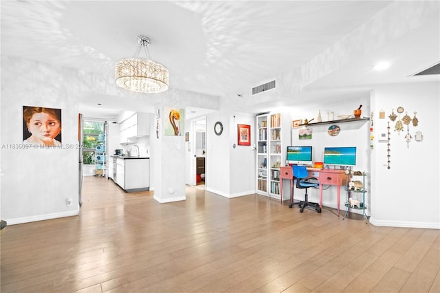 3530 Mystic Pointe Dr Unit 309, Aventura, FL 33180 - living room with a chandelier and wood finished floors