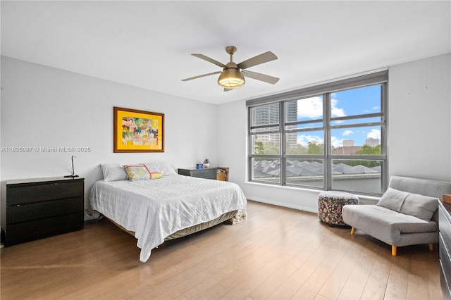 3530 Mystic Pointe Dr Unit 309, Aventura, FL 33180 - bedroom with wood finished floors and a ceiling fan