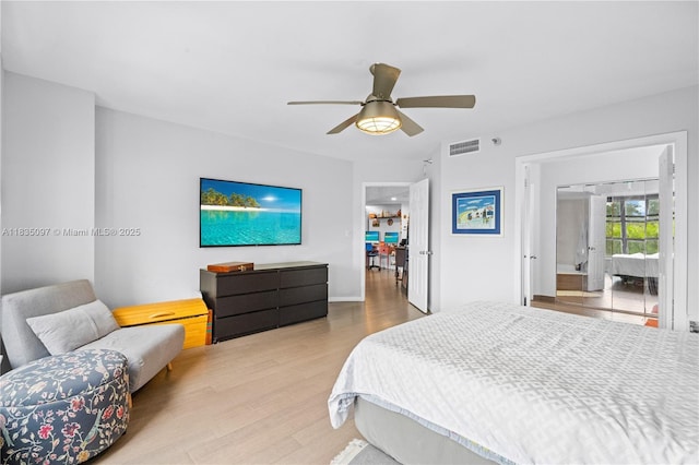 3530 Mystic Pointe Dr Unit 309, Aventura, FL 33180 - bedroom with wood finished floors and ceiling fan