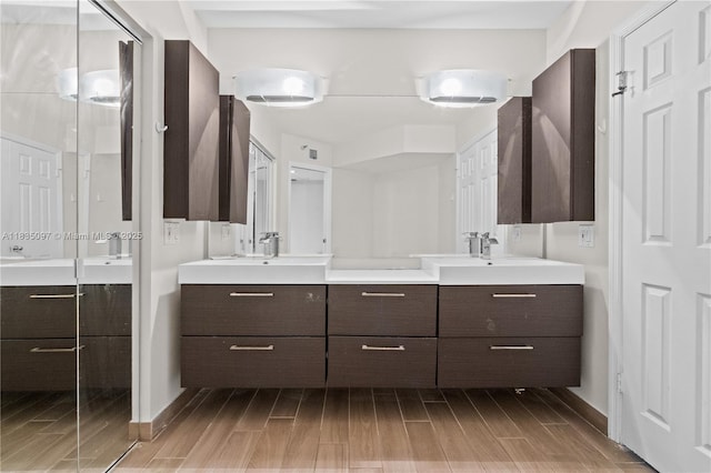 3530 Mystic Pointe Dr Unit 309, Aventura, FL 33180 - full bathroom with wood finished floors and double vanity