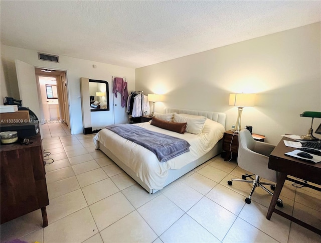 9974 SW 88th St Unit 1033, Miami, FL 33176 - bedroom featuring a textured ceiling and light tile patterned flooring