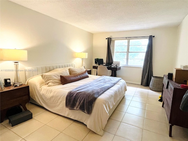 9974 SW 88th St Unit 1033, Miami, FL 33176 - bedroom featuring light tile patterned floors and a textured ceiling