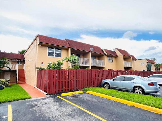 9974 SW 88th St Unit 1033, Miami, FL 33176 - view of building exterior featuring uncovered parking