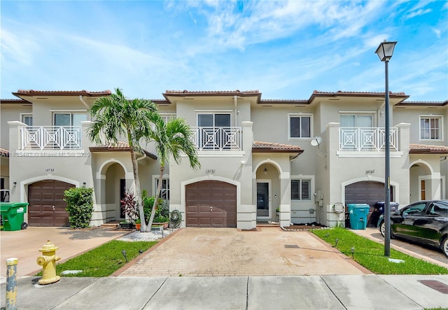 14751 SW 23rd St Unit 14751, Miami, FL 33185 - view of front of home with a balcony, an attached garage, and stucco siding