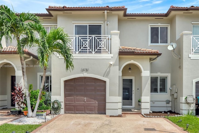 14751 SW 23rd St Unit 14751, Miami, FL 33185 - mediterranean / spanish home featuring a balcony, a tiled roof, stucco siding, and an attached garage