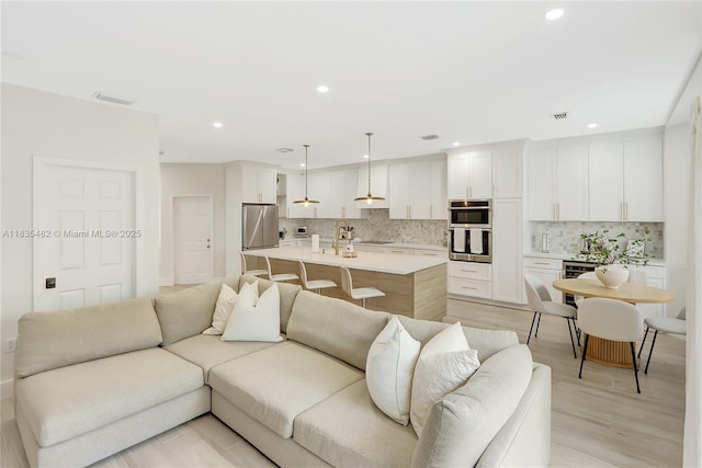14751 SW 23rd St Unit 14751, Miami, FL 33185 - living room with light wood-type flooring and recessed lighting
