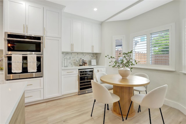 14751 SW 23rd St Unit 14751, Miami, FL 33185 - dining space featuring wine cooler, bar, light wood-type flooring, and recessed lighting