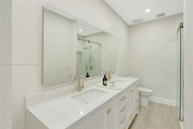 14751 SW 23rd St Unit 14751, Miami, FL 33185 - full bathroom with double vanity, wood finished floors, and a stall shower