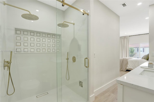 14751 SW 23rd St Unit 14751, Miami, FL 33185 - ensuite bathroom featuring a stall shower, vanity, and wood finished floors