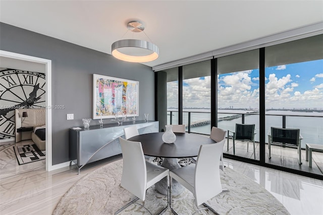3131 NE 7th Ave Unit 4001, Miami, FL 33137 - dining room featuring a wall of windows and marble tiled floors