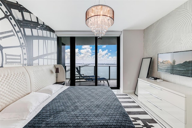 3131 NE 7th Ave Unit 4001, Miami, FL 33137 - bedroom featuring expansive windows, a chandelier, and access to exterior