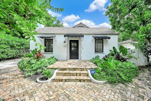 135 NE 87th St, El Portal, FL 33138 - view of front facade with stucco siding and a tile roof
