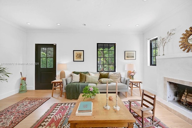 135 NE 87th St, El Portal, FL 33138 - living area with ornamental molding, a fireplace with raised hearth, light wood-type flooring, and recessed lighting