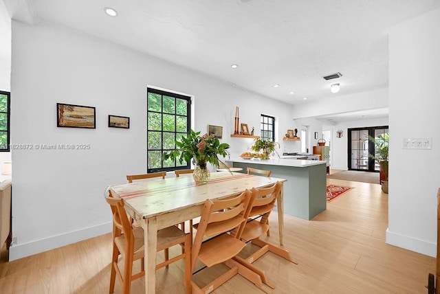 135 NE 87th St, El Portal, FL 33138 - dining area featuring light wood-type flooring and recessed lighting