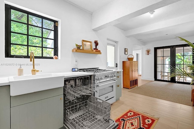 135 NE 87th St, El Portal, FL 33138 - kitchen with designer range, light countertops, light wood-style floors, beam ceiling, and open shelves