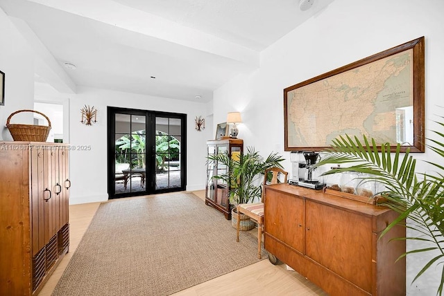 135 NE 87th St, El Portal, FL 33138 - entrance foyer featuring french doors and light wood-style floors