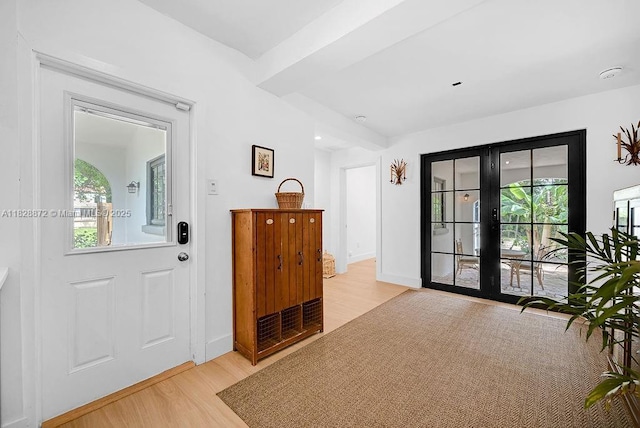 135 NE 87th St, El Portal, FL 33138 - entrance foyer with light wood finished floors and french doors