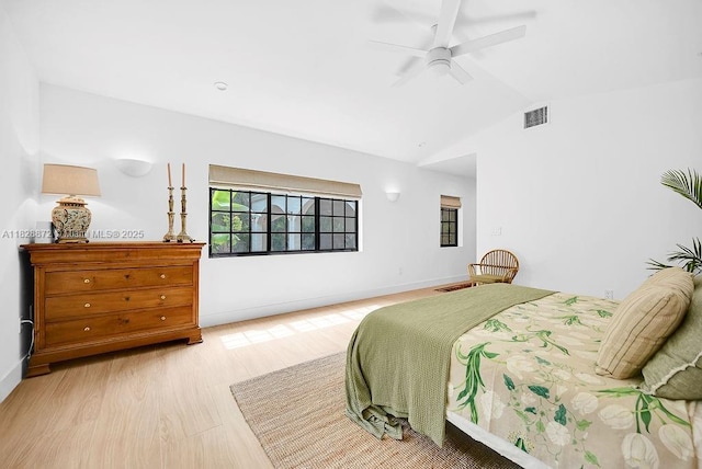 135 NE 87th St, El Portal, FL 33138 - bedroom with light wood-style flooring, lofted ceiling, and a ceiling fan