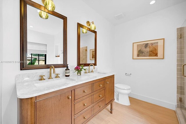 135 NE 87th St, El Portal, FL 33138 - full bath with double vanity, wood finished floors, and tiled shower