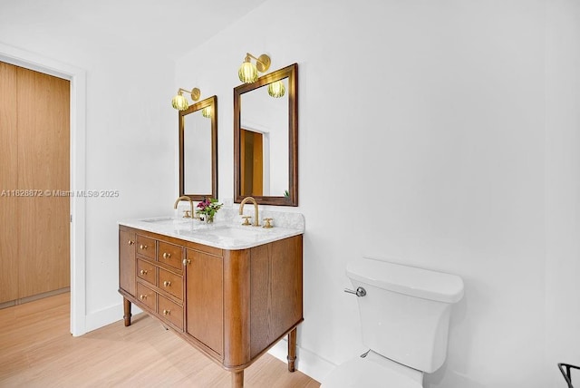 135 NE 87th St, El Portal, FL 33138 - bathroom featuring double vanity and wood finished floors