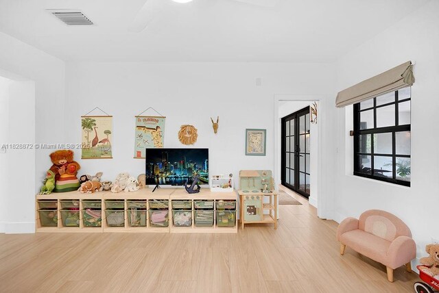 135 NE 87th St, El Portal, FL 33138 - living room featuring wood finished floors and baseboards