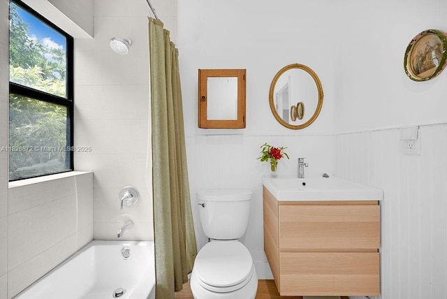 135 NE 87th St, El Portal, FL 33138 - bathroom with vanity, shower / bathtub combination with curtain, and a wainscoted wall
