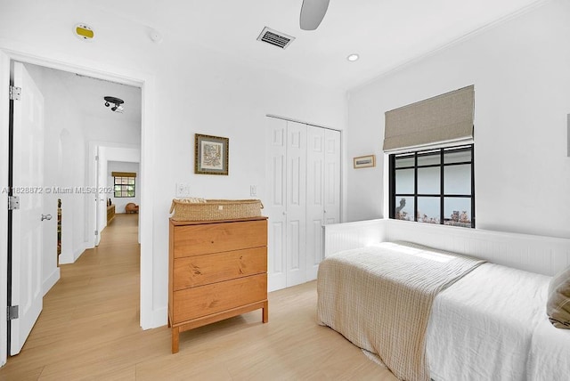 135 NE 87th St, El Portal, FL 33138 - bedroom with light wood-type flooring, a closet, recessed lighting, and ceiling fan