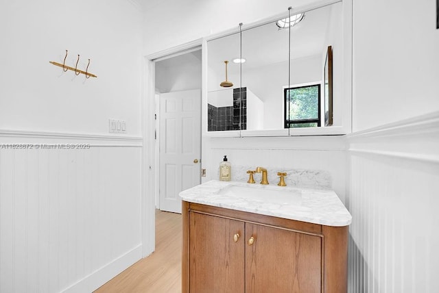 135 NE 87th St, El Portal, FL 33138 - bathroom with vanity, wood finished floors, and tiled shower