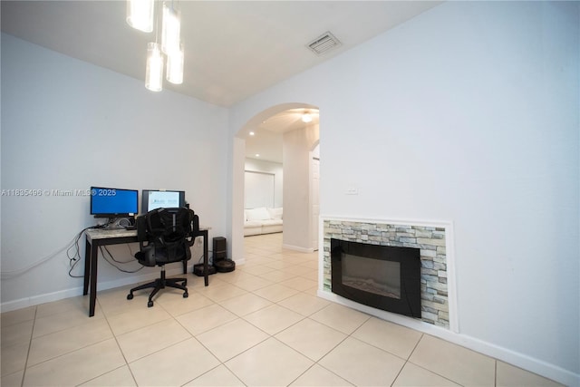 9323 SW 227th St Unit 2-5, Cutler Bay, FL 33190 - home office with arched walkways, a stone fireplace, and light tile patterned floors