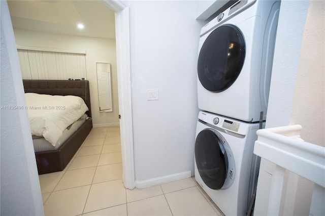 9323 SW 227th St Unit 2-5, Cutler Bay, FL 33190 - laundry room featuring estacked washer and dryer and light tile patterned floors