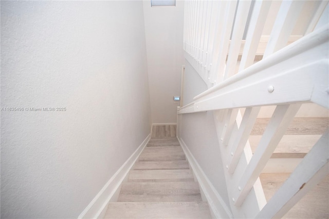 9323 SW 227th St Unit 2-5, Cutler Bay, FL 33190 - staircase featuring wood finished floors and a textured wall
