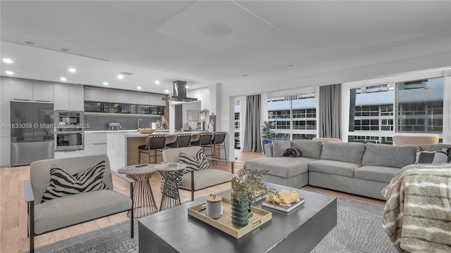3051 NE 47th Ct Unit 207, Fort Lauderdale, FL 33308 - living room featuring light wood-style flooring and recessed lighting