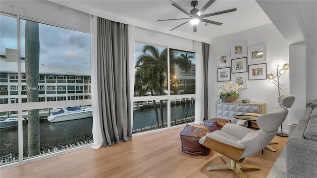 3051 NE 47th Ct Unit 207, Fort Lauderdale, FL 33308 - sitting room with a ceiling fan, wood finished floors, and a water view