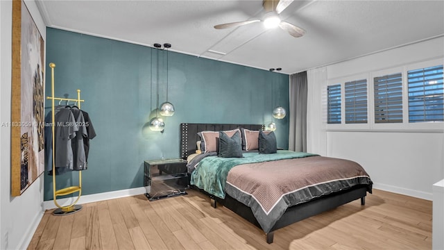 3051 NE 47th Ct Unit 207, Fort Lauderdale, FL 33308 - bedroom with wood finished floors, a ceiling fan, and a textured ceiling