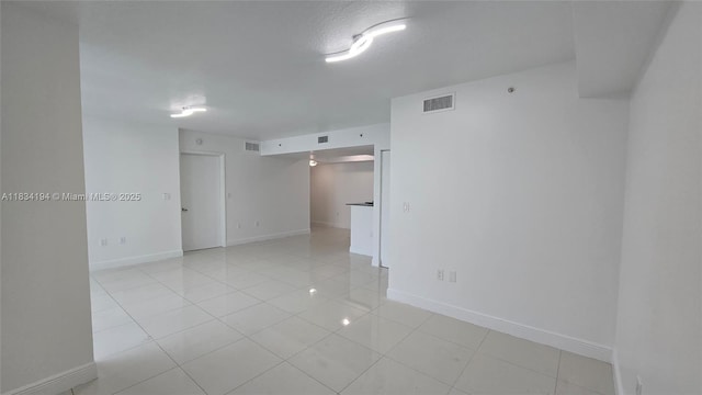 1871 NW S River Dr Unit 1506, Miami, FL 33125 - empty room with light tile patterned flooring and baseboards
