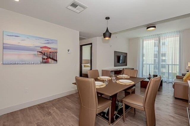 777 N Ocean Dr Unit N401, Hollywood, FL 33019 - dining room with wood finished floors and baseboards