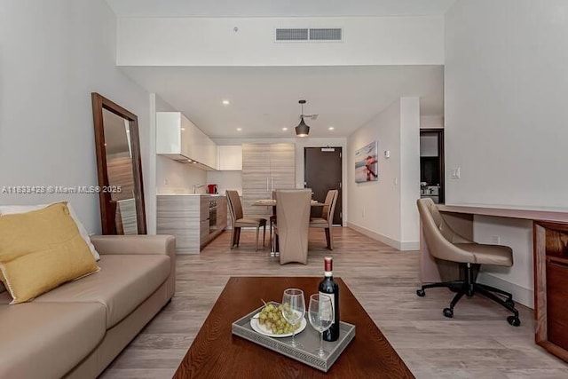 777 N Ocean Dr Unit N401, Hollywood, FL 33019 - living room with light wood-style flooring, an office area, and recessed lighting