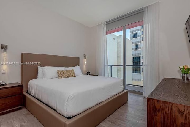 777 N Ocean Dr Unit N401, Hollywood, FL 33019 - bedroom featuring light wood-type flooring and access to outside