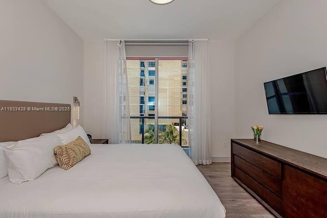 777 N Ocean Dr Unit N401, Hollywood, FL 33019 - bedroom featuring wood finished floors and access to outside